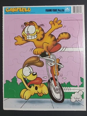 Rompecabezas de 24 piezas vintage 1978 marca dorada Garfield & Odie monociclo bandeja  Foto 1 de 4