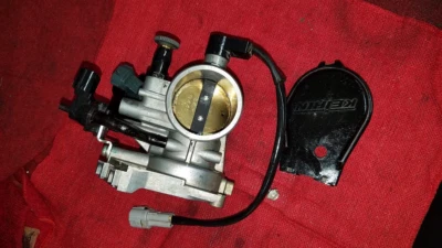 KX450 KX450F KAWASAKI 2021 CARROCERÍA ACELERADOR INYECCIÓN COMBUSTIBLE 16163-1209 Foto 1 de 4