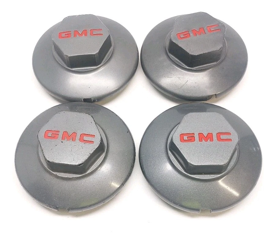 95-99 GMC S15 JIMMY SONOMA JUEGO DE 4 TAPAS CENTRALES DE RUEDA ORIGINALES USADAS GRIS/ROJO #15661028 Foto 1 de 4