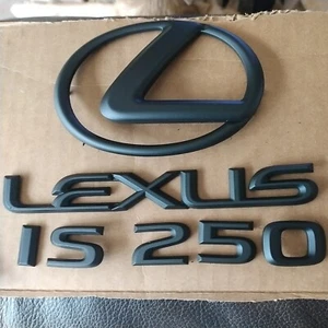 LEXUS IS 250 MATTE BLACK TRUNK LETTERING EMBLEM WITH LOGO USED OEM  - Picture 1 of 5