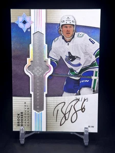 2021-22 Ultimate Collection - Brock Boeser #UE-BO - Ultimate Emblems Auto /49 - Picture 1 of 2