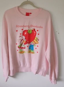 Mercancía Oficial STRAWBERRY SHORTCAKE Mujer XL Cuello Redondo Sudadera Rosa 2023 - Imagen 1 de 5