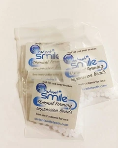 Instant Smile Zähne 10er Pack THERMO PASSENDE PERLEN Kosmetik Dental Makeover - Bild 1 von 1
