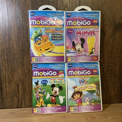 Vtech Mobigo Learning System Game Lot of 4 Dora Minnie Mickey Team Umizoomi - Image 1 of 4