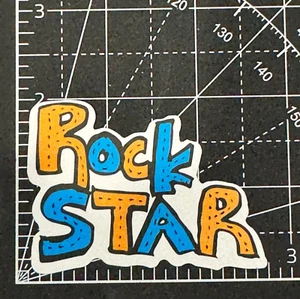 Calcomanía de vinilo Rock Star amarilla y azul pegatina bomba cuaderno vaso bicicleta patinador - Imagen 1 de 5