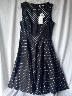 Vestido a lunares blanco y negro sin mangas con falda completa  Foto 1 de 4