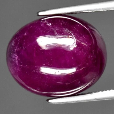 12.53ct 13.7x11mm Oval Cab Purplish Red Ruby Gemstone (Heated Glass Filling) - Image 1 of 4