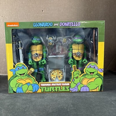 LEONARDO DONATELLO TMNT NECA PAQUETE DE DOS FIGURAS DE ACCIÓN DE DIBUJOS ANIMADOS NUEVAS TORTUGAS NINJA Foto 1 de 4