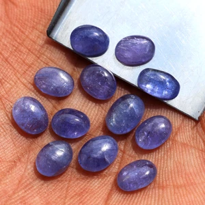 Lotto 12 pezzi pietre preziose sfuse cabochon ovale non trattata tanzanite naturale non trattata 7,7 mm-8,8 mm - Foto 1 di 13
