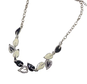 Black and white leaf necklace with clear crystals in a silver finish. NEW - Picture 1 of 3