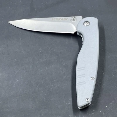 Cuchillo plegable con clip para cinturón con mango gris Schrade  Foto 1 de 3