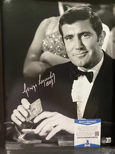 GEORGE LAZENBY SIGNED JAMES BOND 007 MAJESTY 11x14 MOVIE PHOTO BECKETT COA BAS 1 - Picture 1 of 1