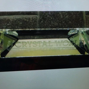 Crystal World sign, is 4" long by 1 3/16" tall, is a sign for dealers - Picture 1 of 3