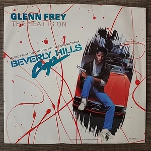 Glenn Frey The Heat Is On/Shoot Out Harold Faltermeyer 7" 45 RPM(Picture Sleeve) - Foto 1 di 4