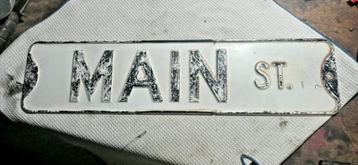 Letrero de calle vintage de acero en relieve principal ST lado doble 2 letreros 24x6 original Foto 1 de 4