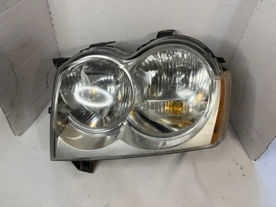 Jeep Grand Cherokee 2005-2007 fabricante de equipos originales luz del conductor izquierdo faro probado GC1 Foto 1 de 4