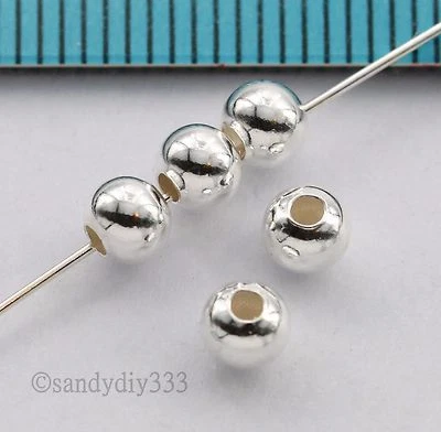 100x CUENTAS ESPACIADORAS REDONDAS SIN COSTURAS DE PLATA ESTERLINA BRILLANTE 4mm #1513A Foto 1 de 2
