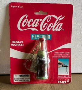 Vintage Coca Cola Bottle Collectible Keychain 1999 Watch The Coke Disappear - Picture 1 of 3