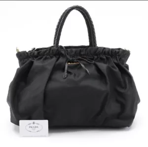 Moño Bauletto negro tejido y cuero Prada - Imagen 1 de 8