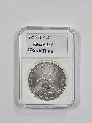 2023 $1 American Silver Eagle Mint Error Reverse Struck Thru - Image 1 of 2