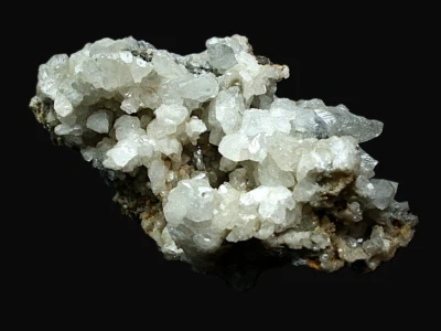MINERALS : CLEAR TO WHITE CERUSSITE CRYSTALS ON MOST SIDES. TSUMEB MINE, NAMIBIA - Image 1 of 4