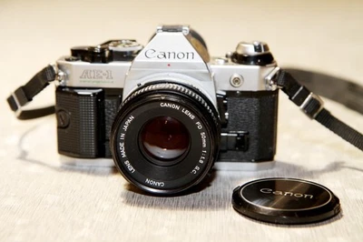 CANON AE-1 PROGRAM + 3 objectifs + doubleur FOCA + Power Winder A2 - Photo 1/4