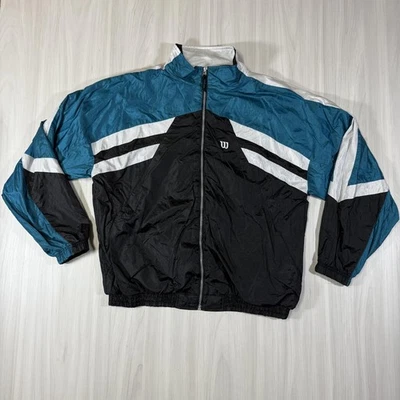 Chaqueta cortavientos vintage Wilson para hombre XL negra verde azulado blanca pista bloques de colores años 90 Foto 1 de 4