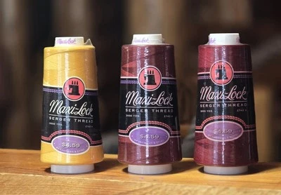 Maxi-Lock Serger Thread Tex 27 (1) Gold (2) Burgandy 3000 Yard Spools - Image 1 of 4