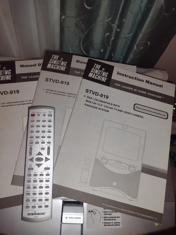 THE SINGING MACHINE DVD KARAOKE PLAYER MODEL STVD-919  REMOTE CONTROL & MANUALS - Image 1 of 4