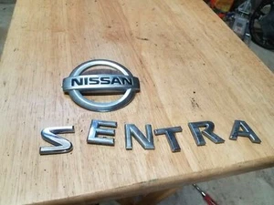 07 08 09 10 11 12 NISSAN SENTRA REAR LID EMBLEM LOGO BADGE SIGN SYMBOL - Picture 1 of 1