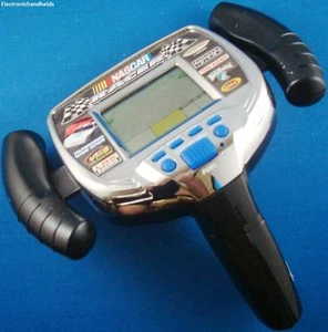 RADICA TM NASCAR RACER ELECTRONIC HANDHELD GAME ARCADE SILVER MONTE CARLO 1998 - Picture 1 of 1