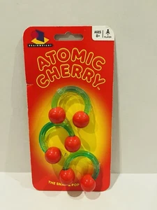 Atomic Cherry Game - 1 giocatore età 8+ Brainwright Brain Twist Game - Foto 1 di 4