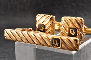 Barra de corbata "Christian Dior", gemelos color dorado y negro estuche propio estilo vintage. - Imagen 1 de 23