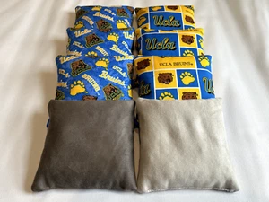 BOLSAS DE FRIJOLES CORNHOLE UCLA BRUINS ~ JUEGO DE 8 BOLSAS DE PALO Y RESBALADIZAS - Imagen 1 de 1