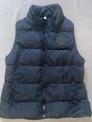 Chaleco acolchado Fabletics para mujer mediano negro cremallera completa bolsillo ligero Foto 1 de 4