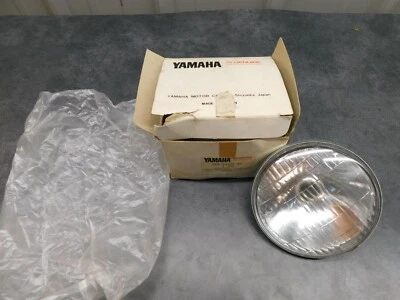 Yamaha NOS OEM Head Light Lens 1971 JT1 6V 15/15W 288-84120-60 2330  - Image 1 of 4