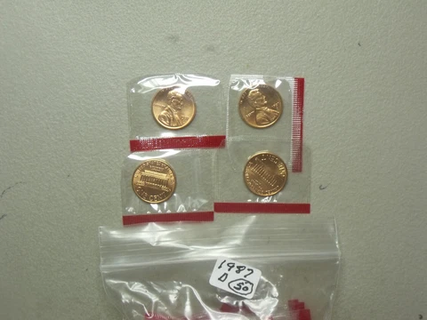 1987-D  Lincoln Cents (50 coins)  Nice BU coins in mint cellophane Cover