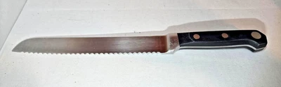 Cuchillo para pan forjado Farberware Pro, borde dentado, 13" de largo, excelente estado Foto 1 de 4