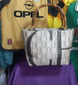 Carolina Herrera leather, fabric and wood shopping bag bearing the CH logo