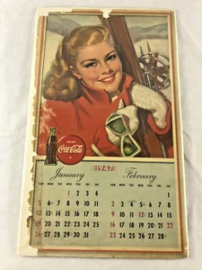 1947 Coca-Cola, pagina calendario Coca-Cola, donna sciatrice, gennaio, febbraio - Foto 1 di 9
