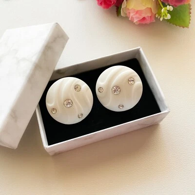 Pendientes de clip de plástico con diamantes de imitación brillantes luces blancas Avon 1987 vintage Foto 1 de 4