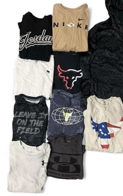 Lotto Abbigliamento Under Armour Ragazzo Taglia Media Pantaloni e Camicie Maniche Lunghe Pantaloncini - Immagine 1 di 4