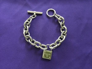 MICHAEL KORS SILVER TONE CHAIN LINK TOGGLE BRACELET WITH LOCK CHARM - Picture 1 of 5