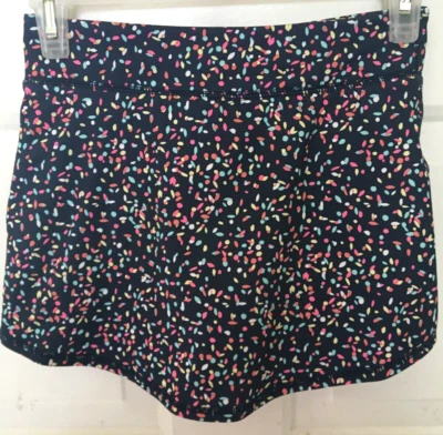 Falda corta de tenis Gap para niña talla 10-11 negra verde rosa usada en excelente estado Foto 1 de 4
