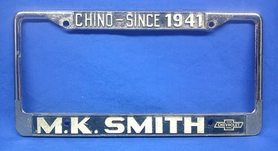 Vintage M.K. Smith Chevrolet Dealership Chino Ca. Die Cast License Plate Frame - Image 1 of 4