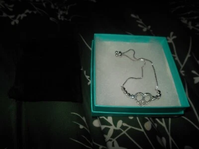 PULSERA LEGADO PAZ Y AMOR "CORAZÓN DE PAZ" ENCANTO AJUSTABLE DIAPOSITIVA COLOR PLATA  Foto 1 de 4