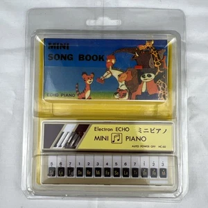 Mini piano eco electrón amarillo vintage con mini cancionero - sin sonido - Imagen 1 de 4