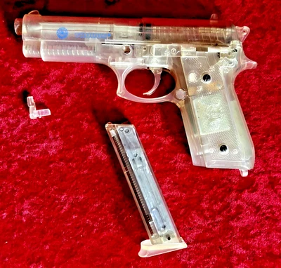 PISTOLA AIRSOFT TAURUS MOTORIZADA POR RESORTE KWC PLÁSTICO TRANSPARENTE B6 Foto 1 de 2