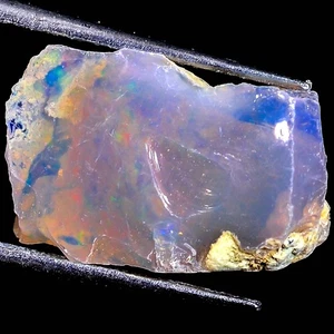 Impresionante piedra preciosa áspera de ópalo etíope fuego Welo 100 % natural 15x11x09 mm 4,85 quilates - Imagen 1 de 3