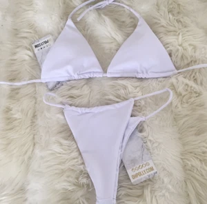 ¡NUEVO! OH POLLY STRING LEADER MICRO TRIANGLE BIKINI BLANCO 2 PIEZAS SET TOP & BOTTOM - Imagen 1 de 4
